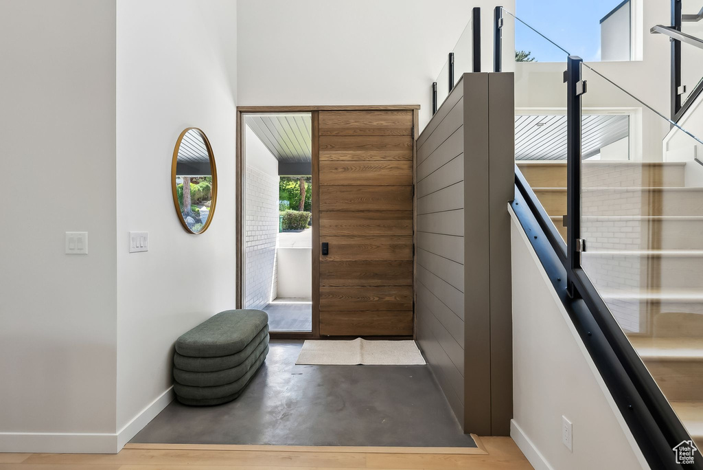 Entryway with concrete flooring and baseboards