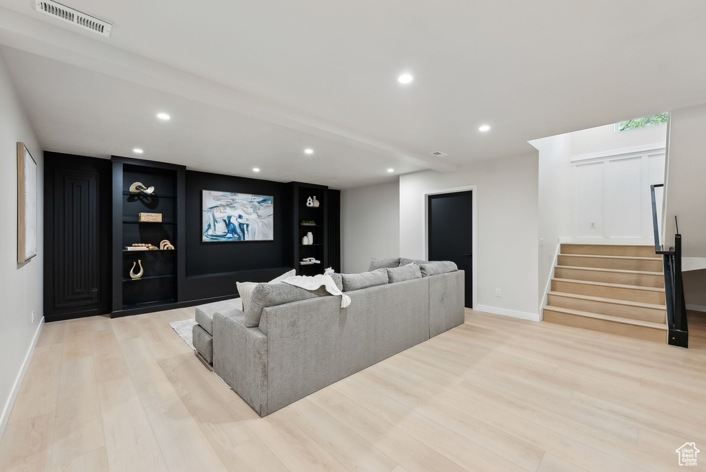 Cinema room with baseboards, recessed lighting, light wood-style flooring, and visible vents