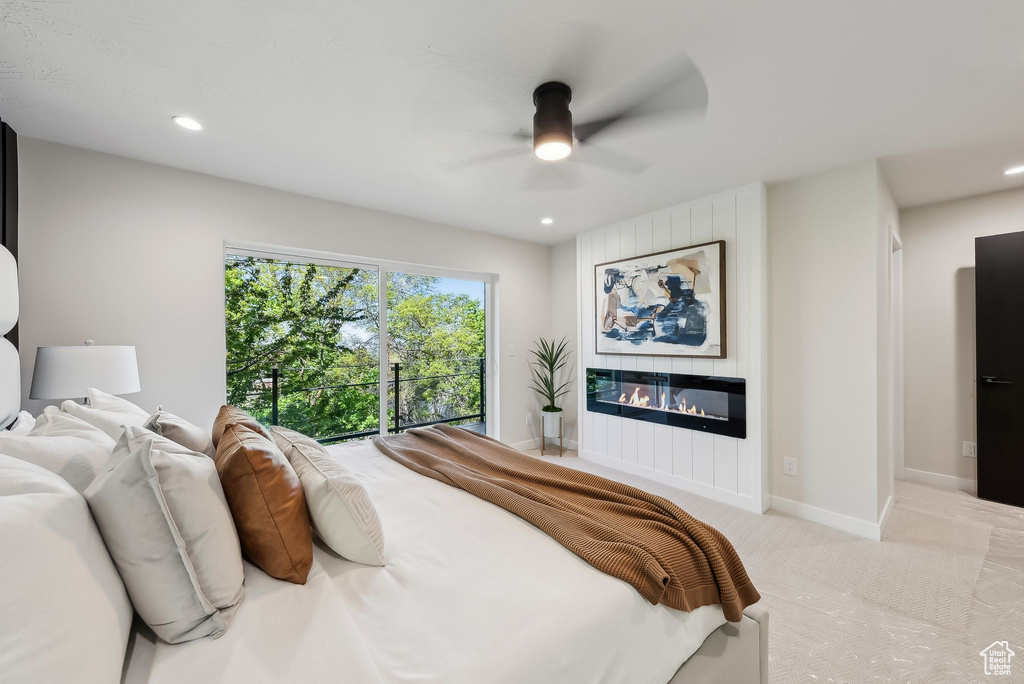 Bedroom with a large fireplace, carpet floors, ceiling fan, and recessed lighting