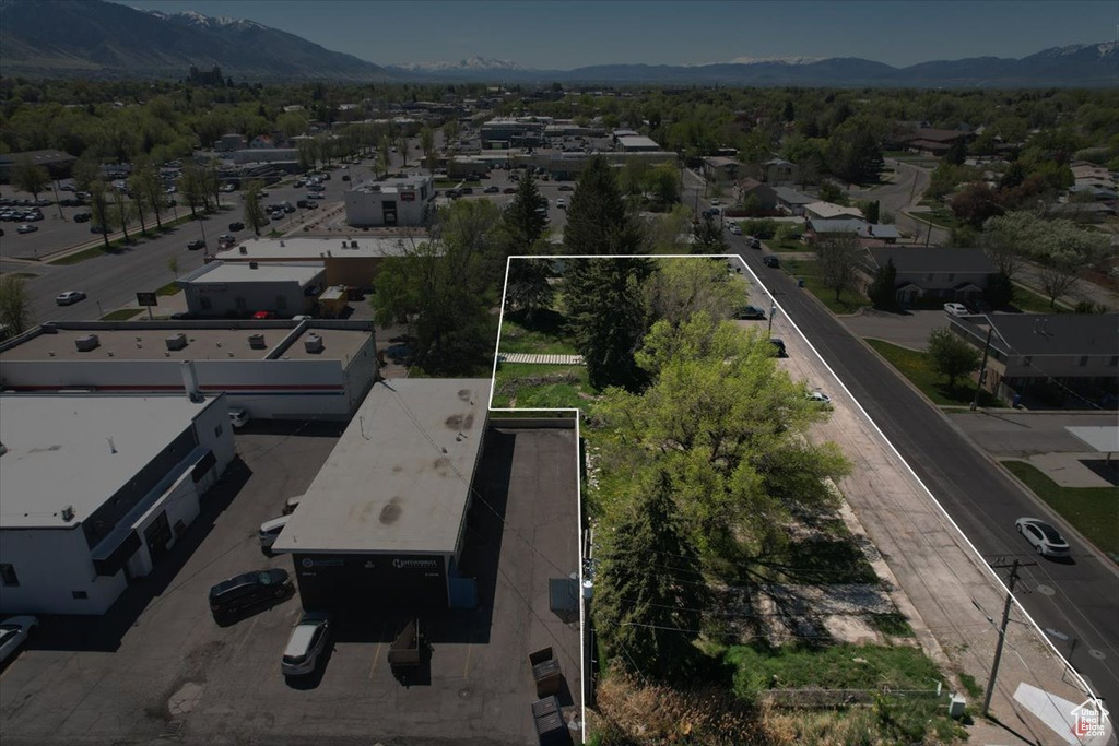 Birds eye view of property featuring a mountain view