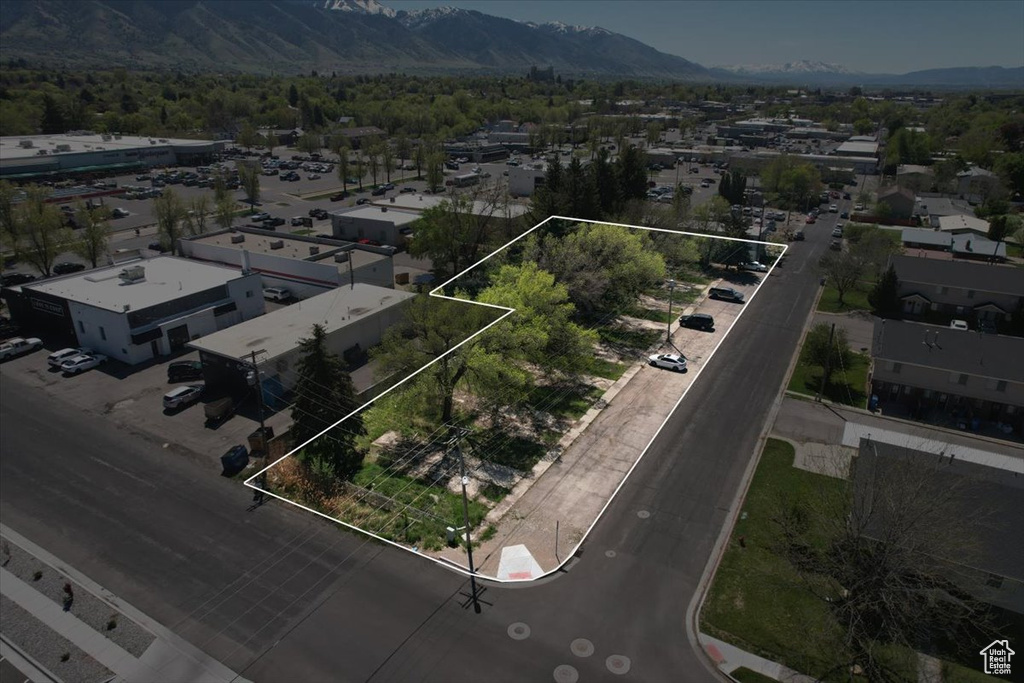 Birds eye view of property with a mountain view