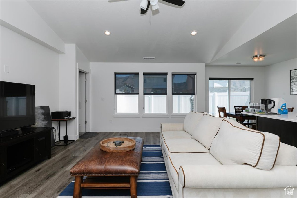 Living area with ceiling fan, recessed lighting, wood finished floors, and visible vents