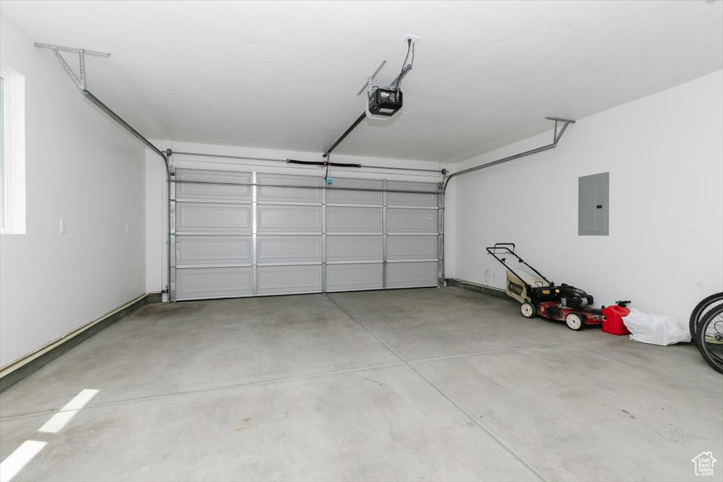 Garage with a garage door opener and electric panel