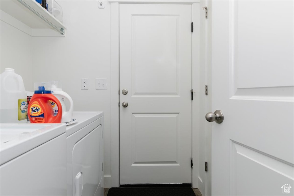 Laundry room with washing machine and clothes dryer and laundry area