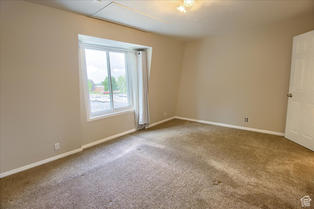 Unfurnished room with carpet and baseboards