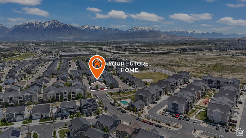 Birds eye view of property with a residential view and a mountain view