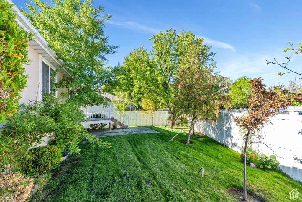 View of yard with a fenced backyard