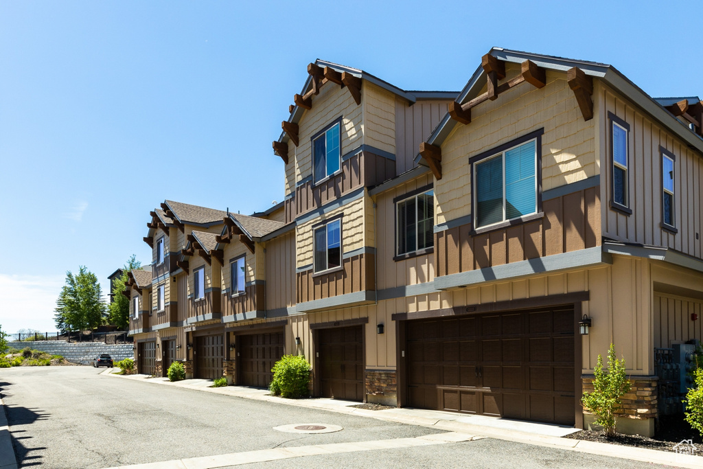 View of building exterior with an attached garage