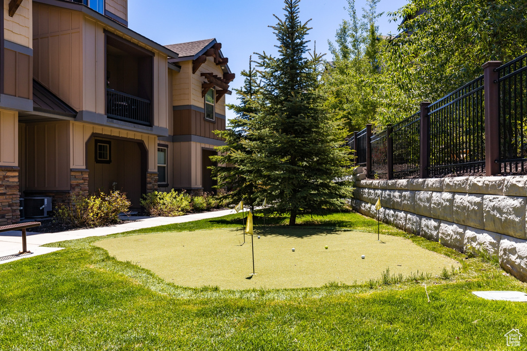View of home's community featuring fence