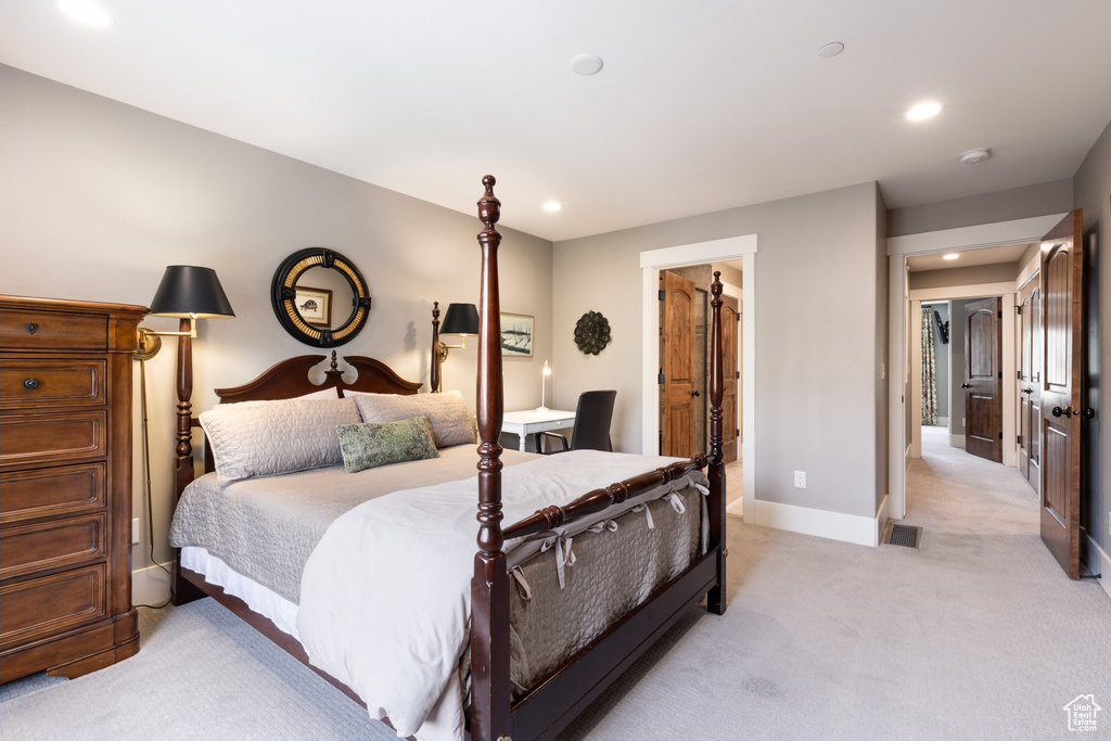 Bedroom featuring light colored carpet, recessed lighting, baseboards, and visible vents