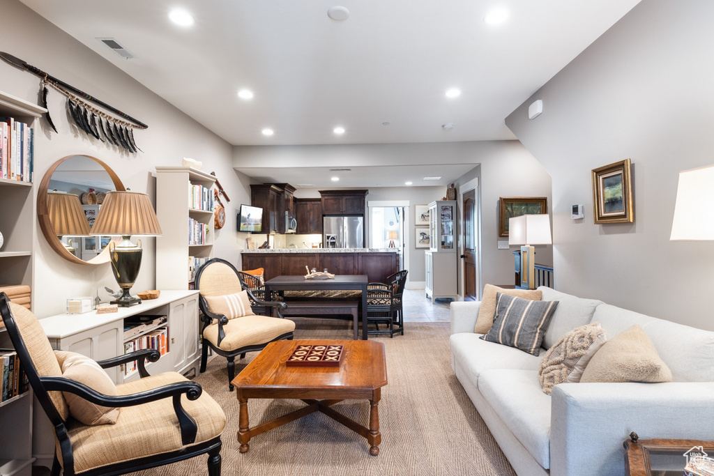 Living room featuring recessed lighting and visible vents