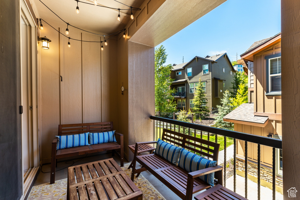 Balcony with an outdoor living space and a residential view