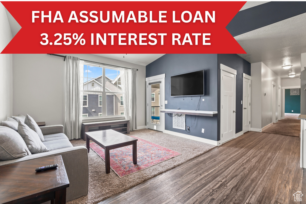 Living area featuring wood finished floors and baseboards