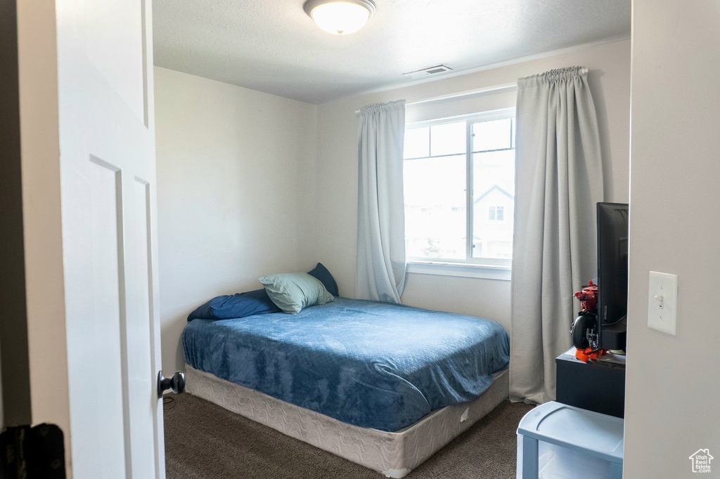 Bedroom with carpet flooring