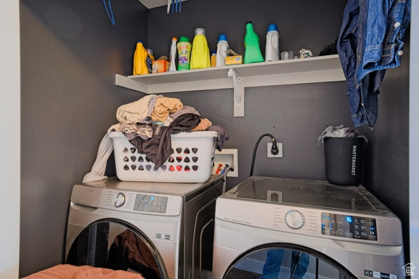 Laundry room with laundry area and separate washer and dryer