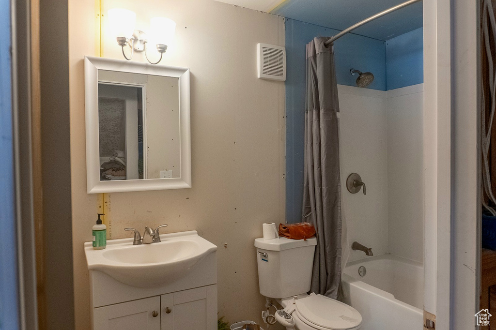 Full bathroom with vanity and shower / bath combo
