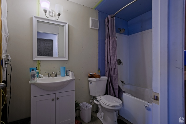 Full bathroom featuring toilet, shower / tub combo, vanity, and visible vents