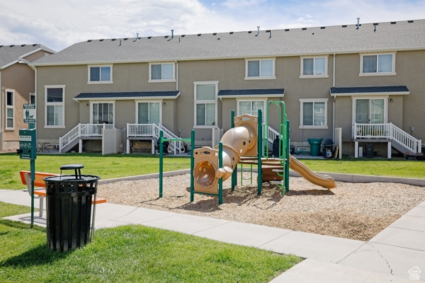 Communal playground featuring a yard