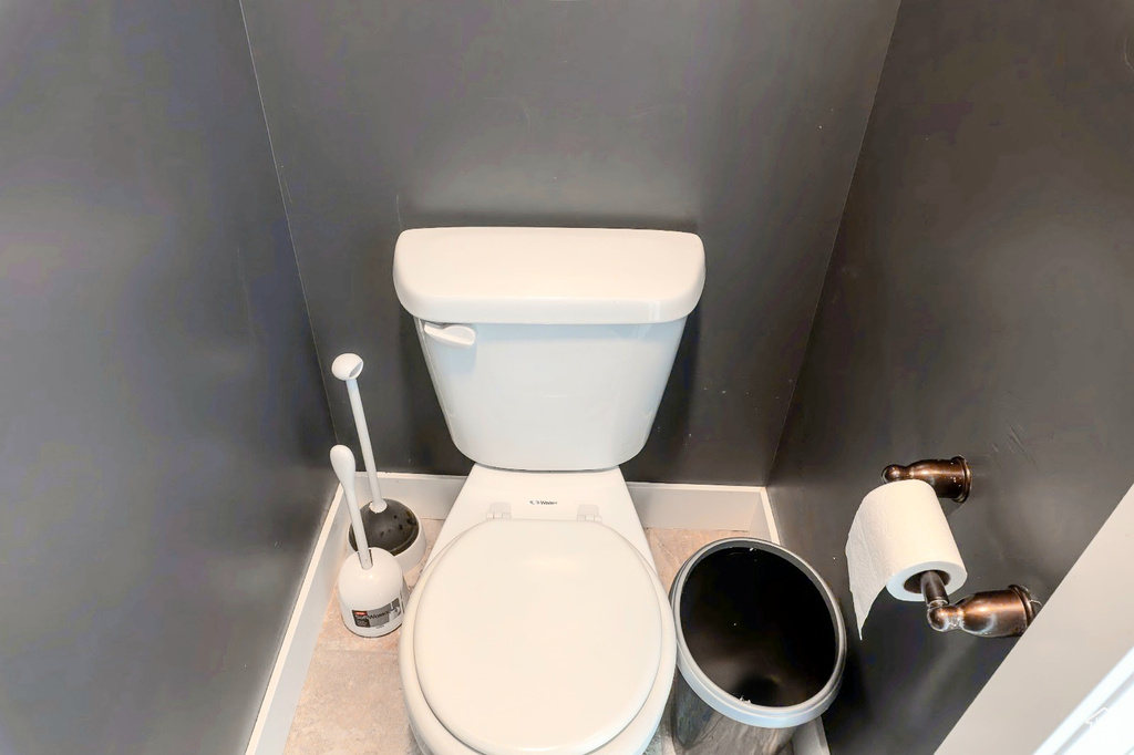 Bathroom view of toilet and baseboards