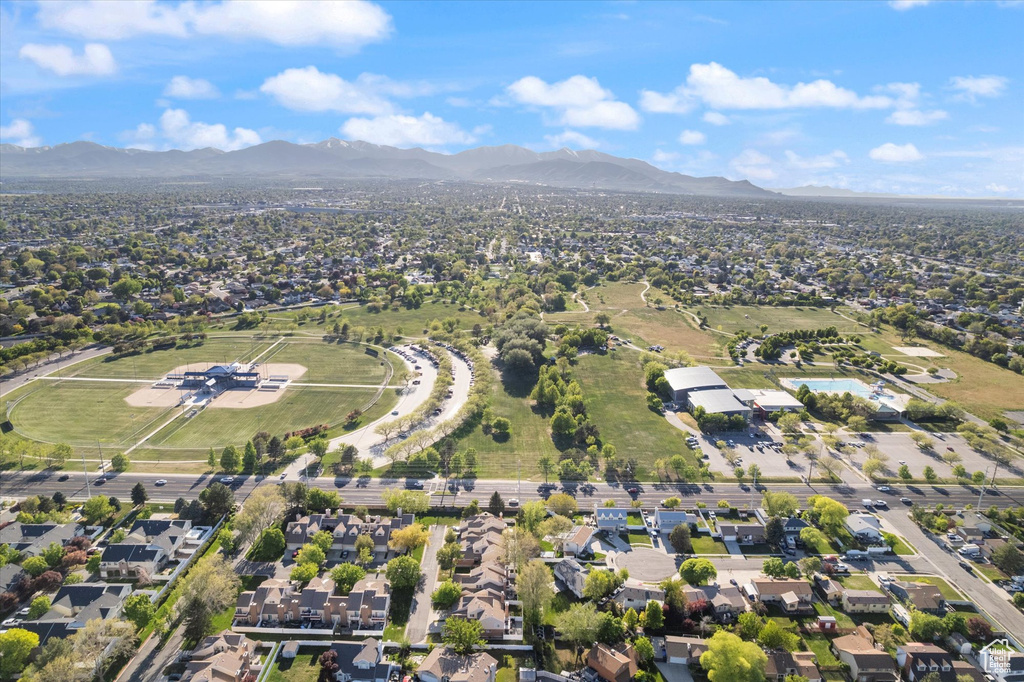 Birds eye view of property featuring a mountain view and a residential view