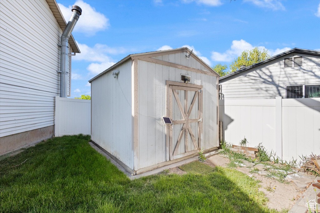View of shed with fence