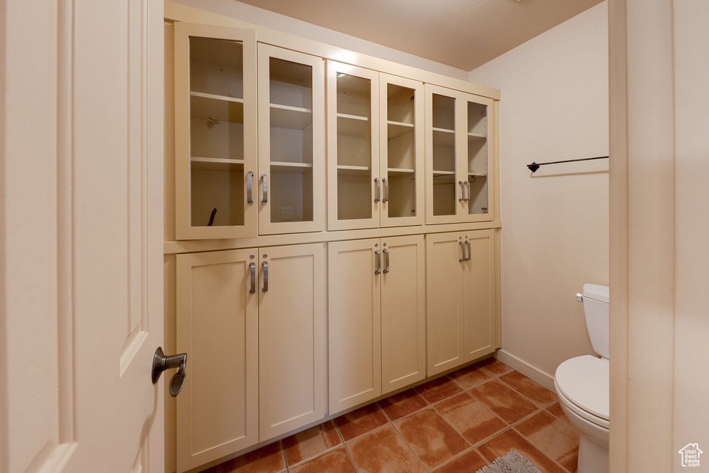 Bathroom with toilet and baseboards
