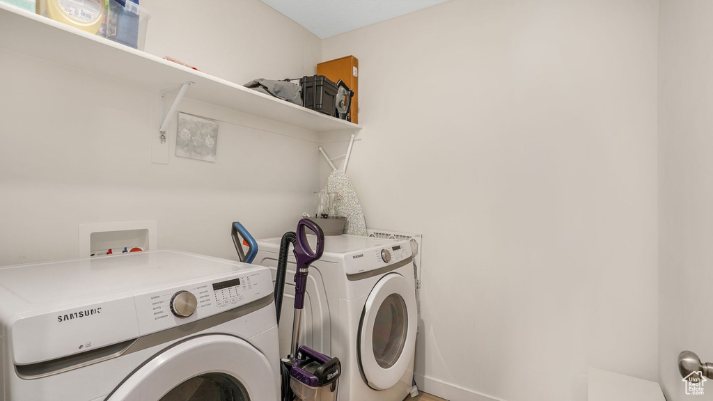 Laundry area featuring laundry area and washing machine and dryer