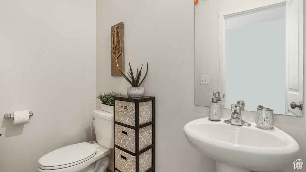 Bathroom featuring a sink and toilet