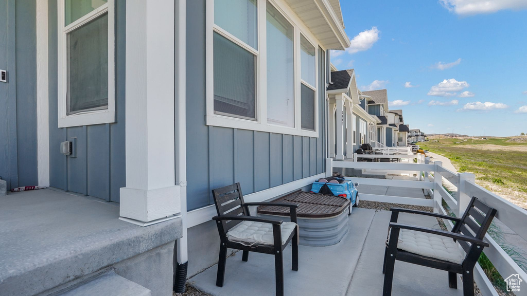 View of patio / terrace featuring a residential view and a balcony