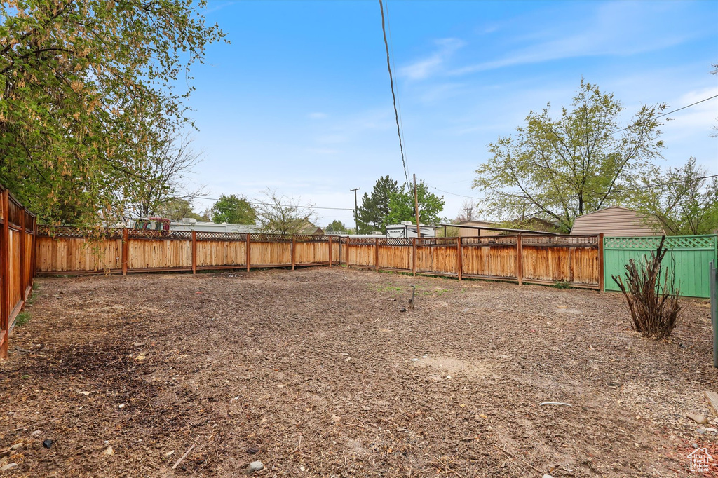 View of yard with a fenced backyard