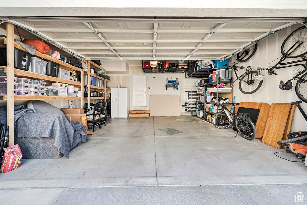 Garage with white fridge with ice dispenser