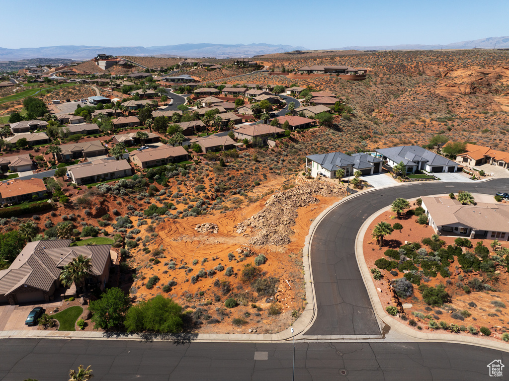Birds eye view of property featuring a mountain view, a residential view, and view of desert