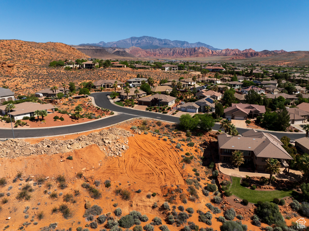 Birds eye view of property with a mountain view and a residential view