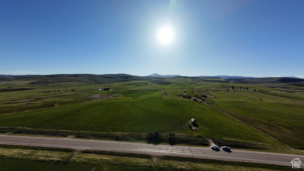 Birds eye view of property with a mountain view and a rural view