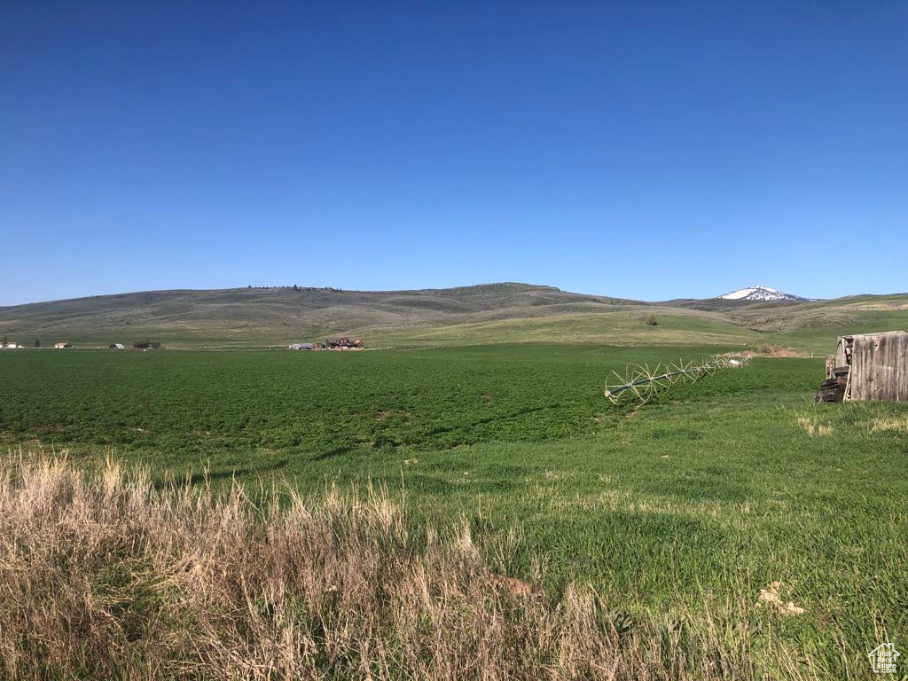 View of mountain backdrop with rural landscape
