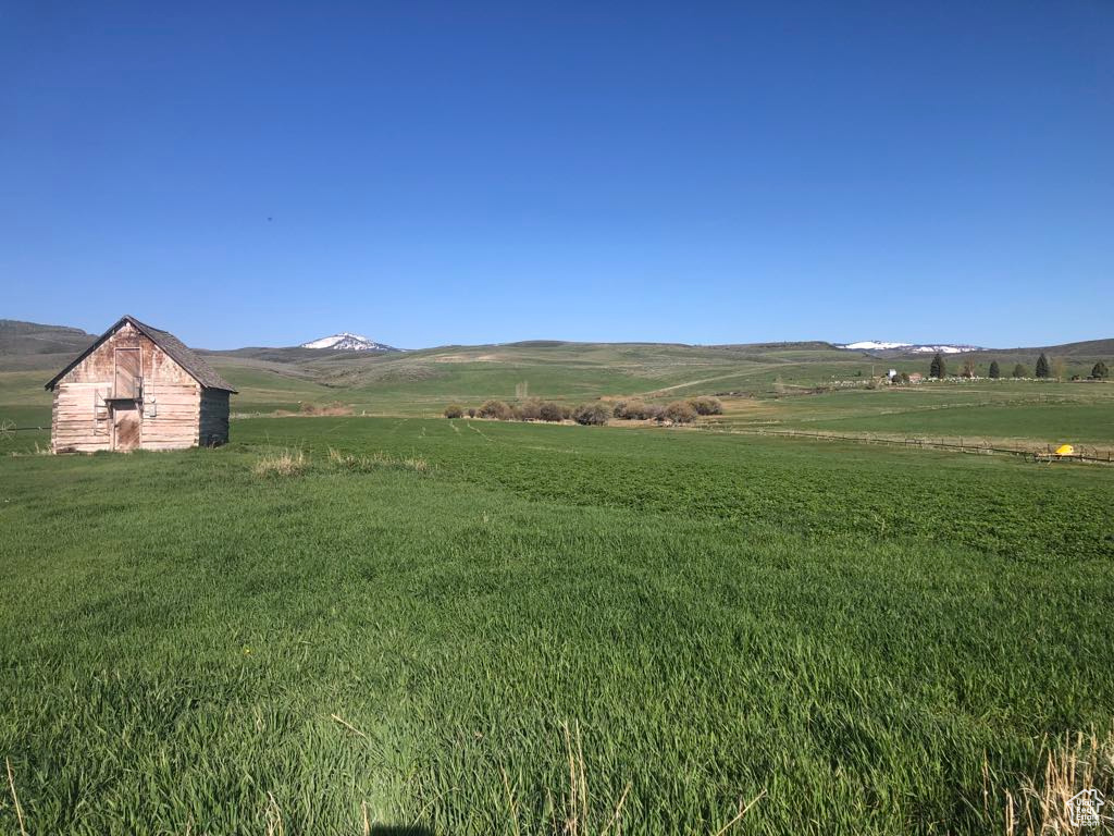 View of mountain background featuring rural landscape