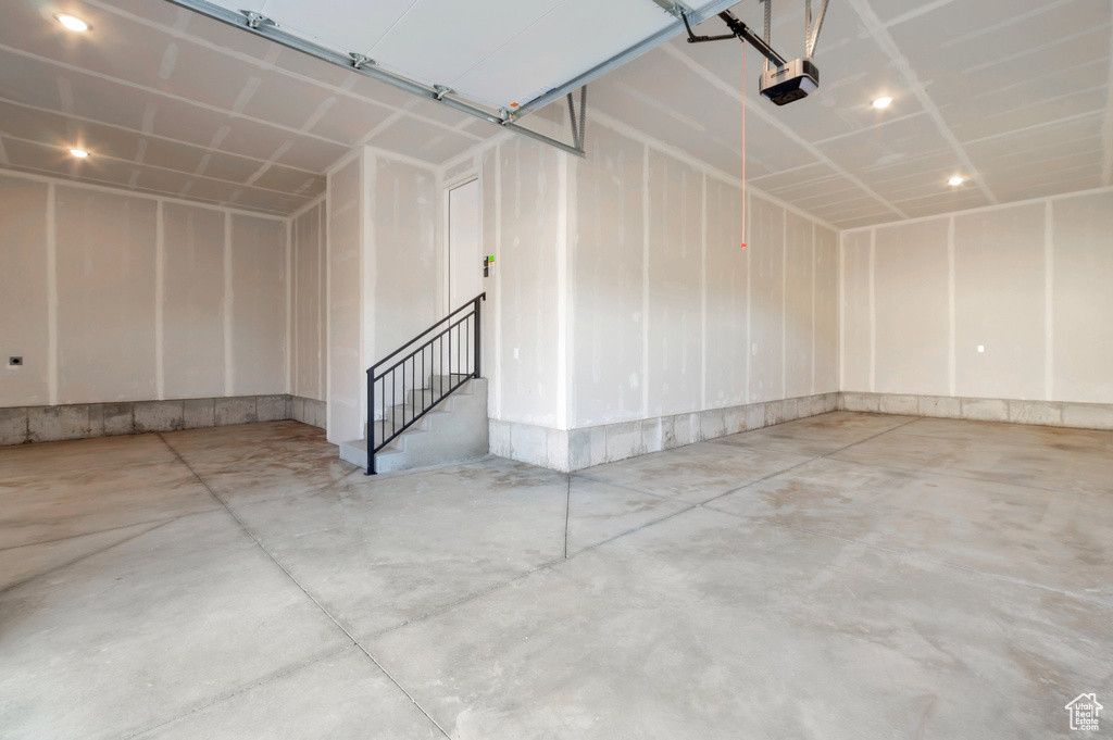 Garage featuring a garage door opener