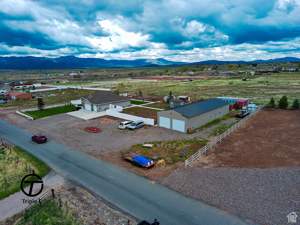 Aerial view of sparsely populated area featuring a mountainous background
