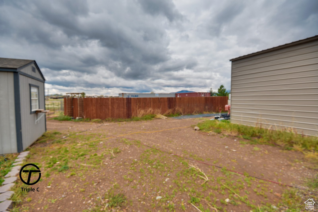 View of yard featuring fence