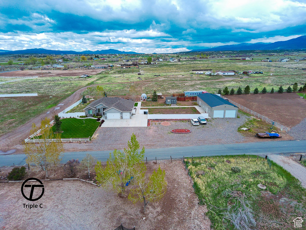 Aerial view of sparsely populated area with a mountain backdrop
