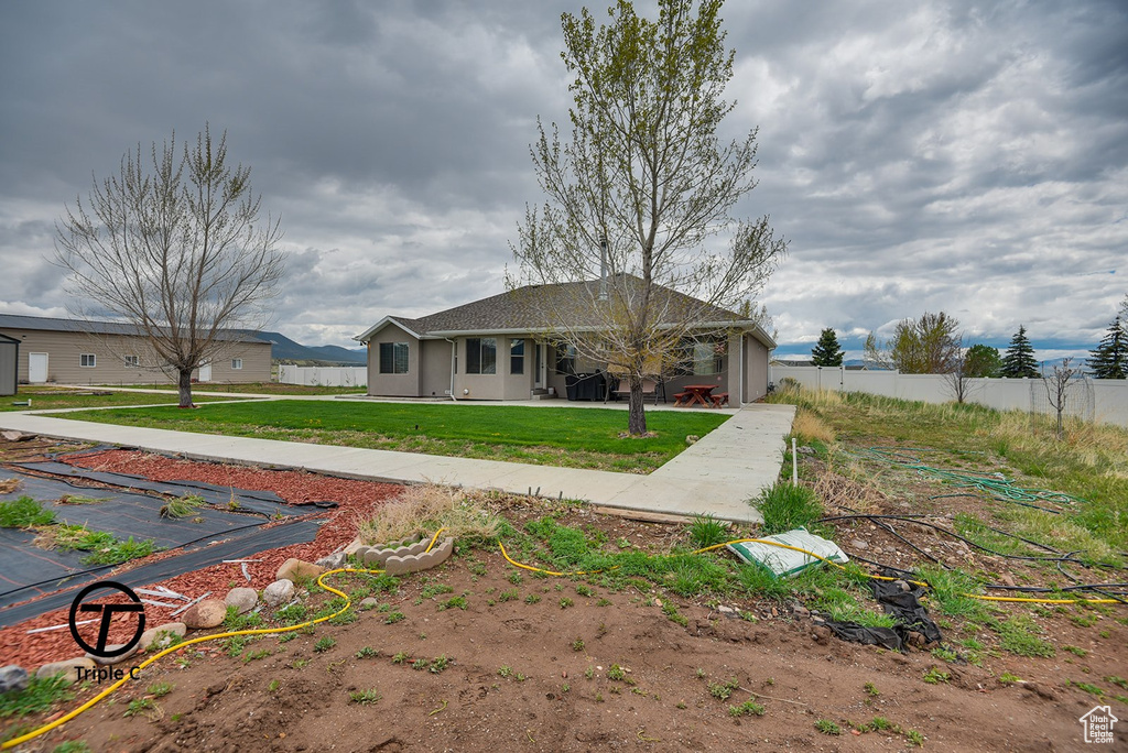 Ranch-style home with a patio area