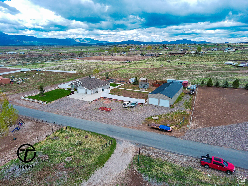 Overview of rural landscape featuring a mountain backdrop