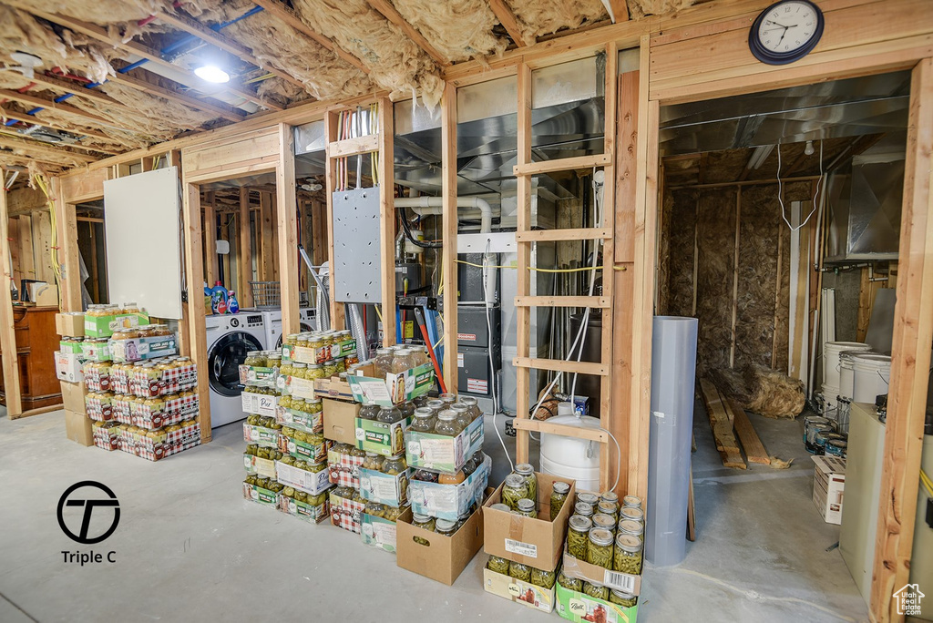 Unfinished basement featuring washer / dryer