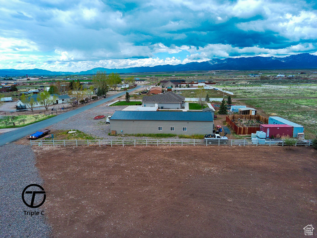Overview of rural landscape featuring a mountain backdrop