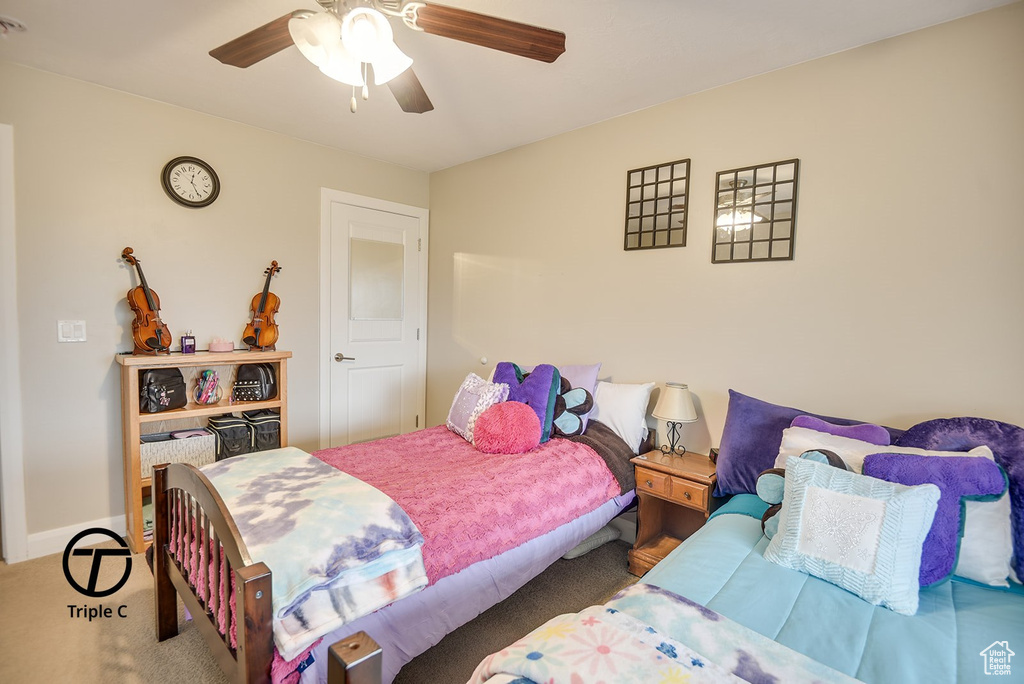 Bedroom featuring carpet and ceiling fan