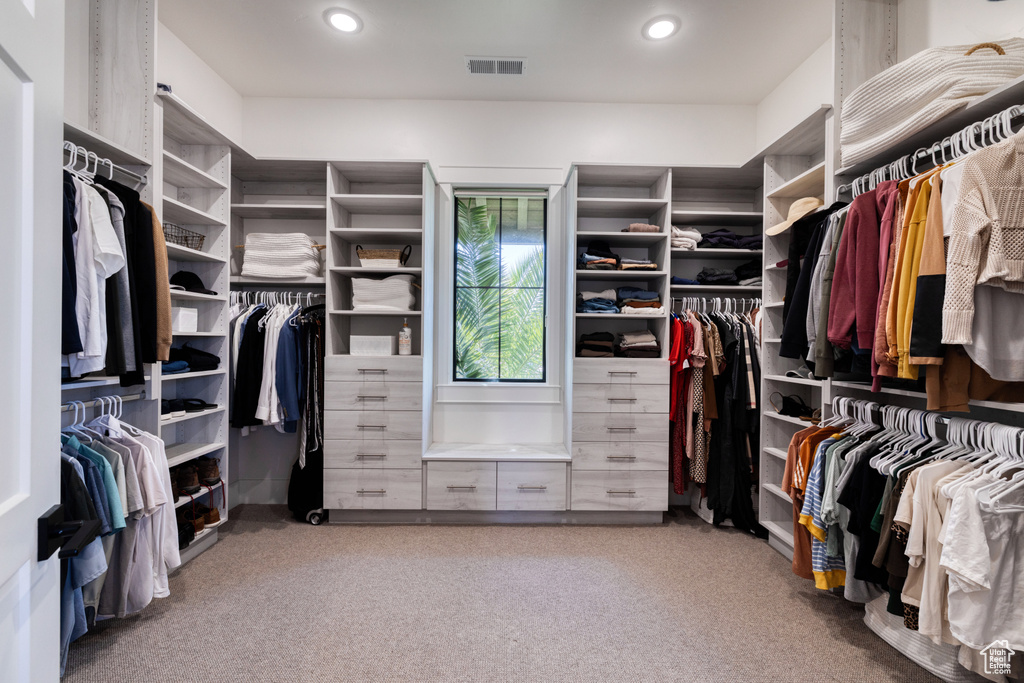 Walk in closet featuring carpet flooring and visible vents