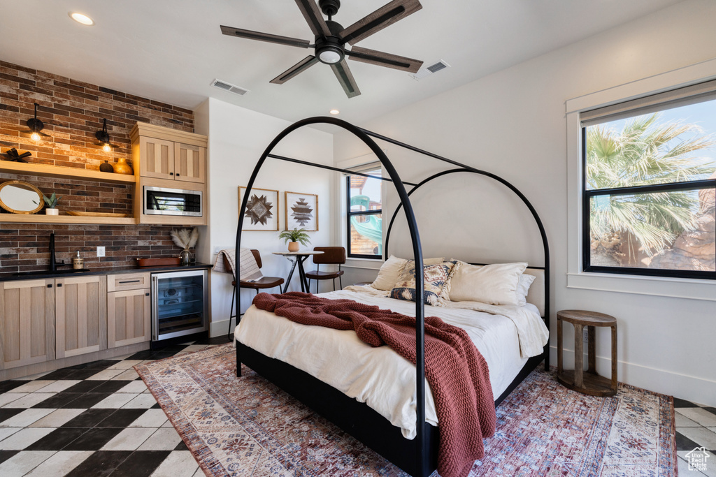 Bedroom featuring beverage cooler, baseboards, visible vents, and recessed lighting