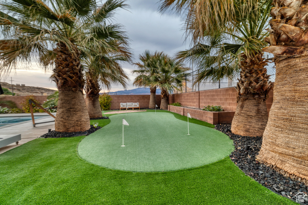 View of community with a swimming pool and a fenced backyard