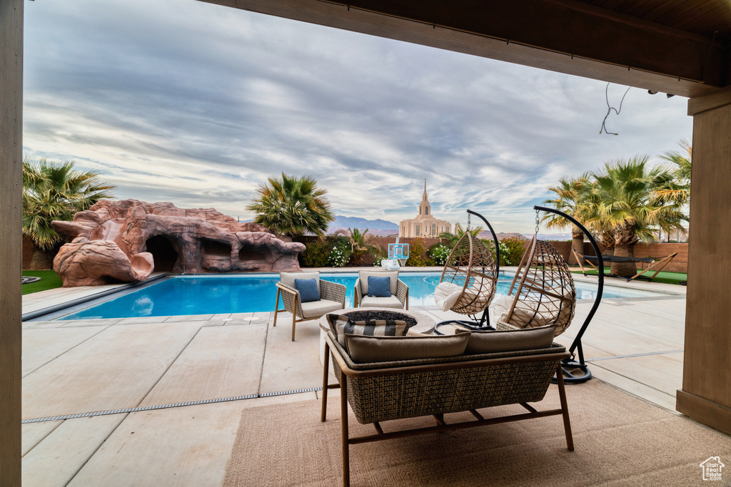 View of pool featuring a patio and a fenced in pool