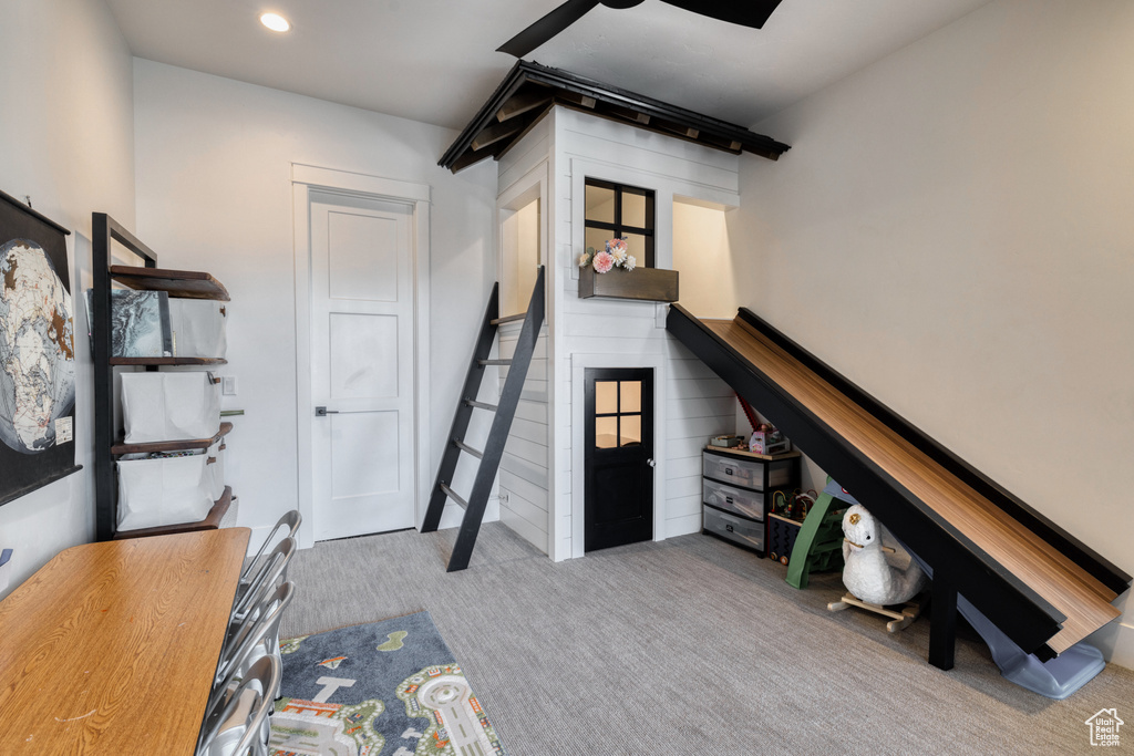 Interior space with carpet floors and recessed lighting